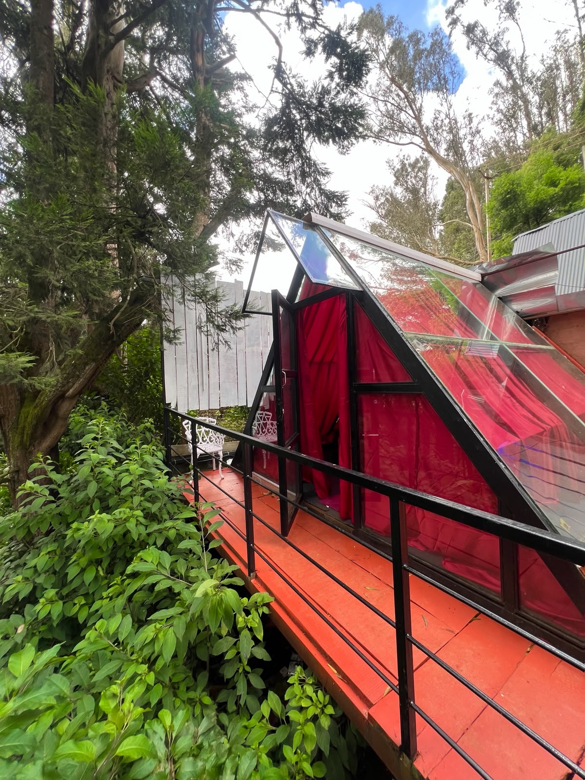 Authentic Glass house room immersed in Nilgiri forest at The Groot Ooty